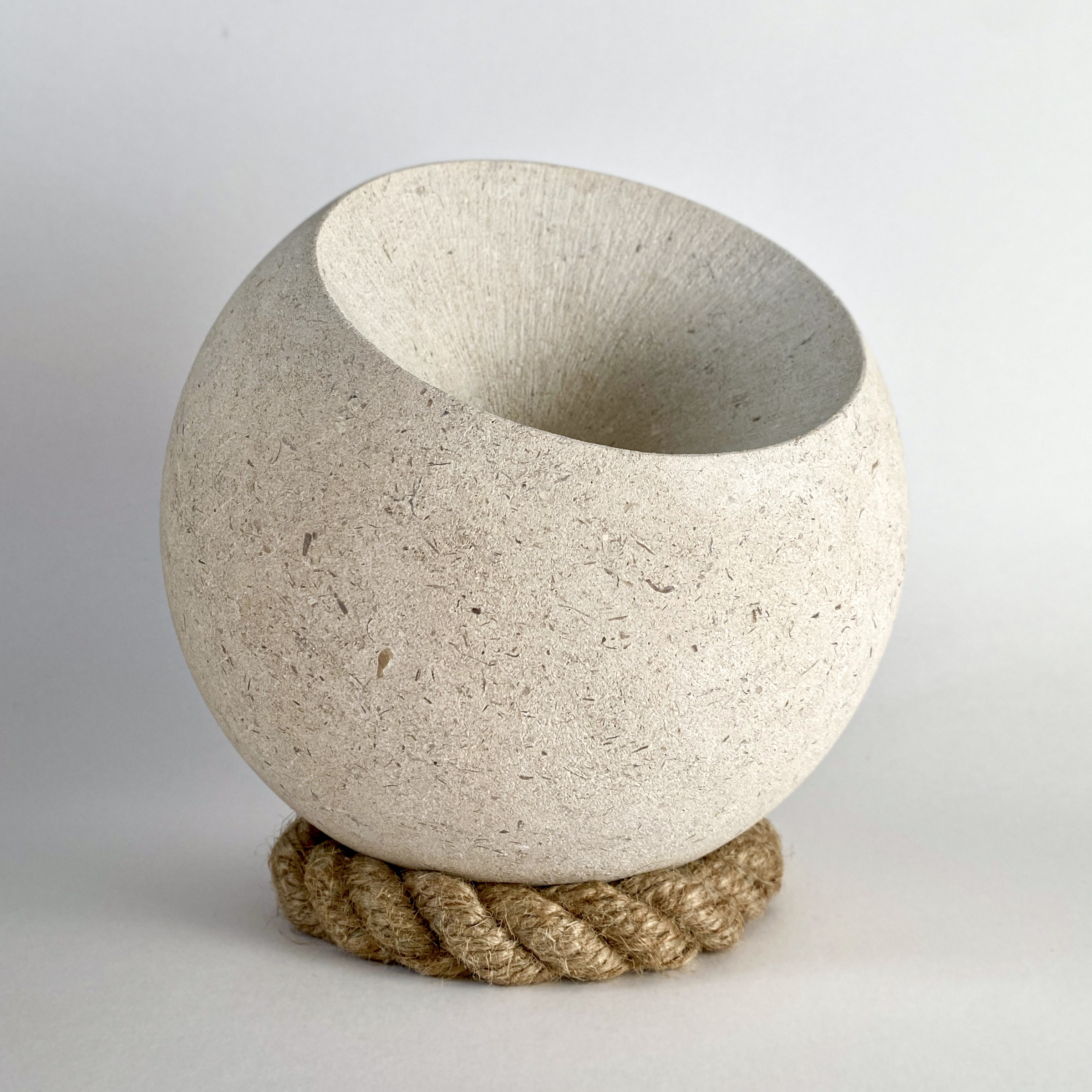 stone sphere with a cone shape carved out