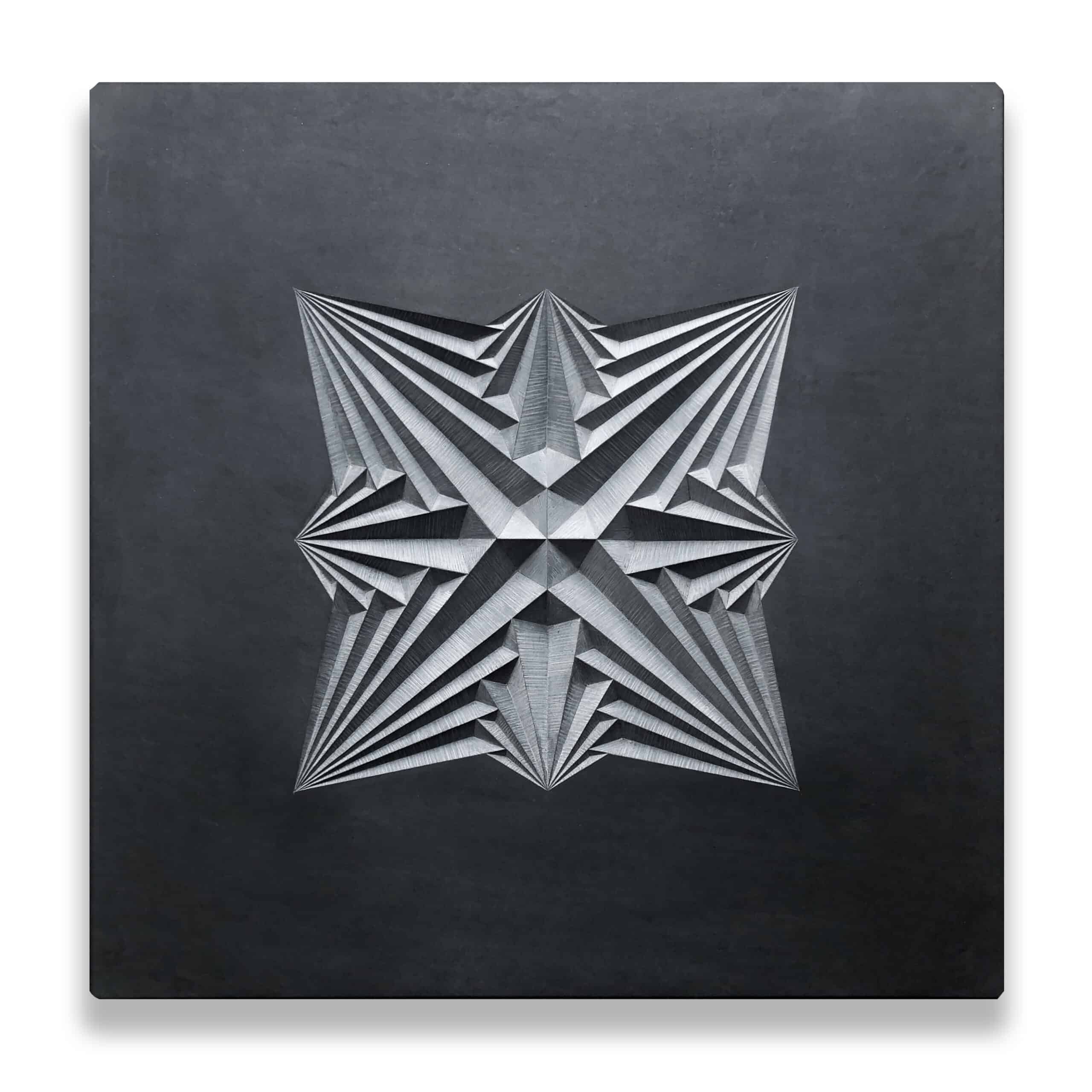 linear geometric pattern carved into dark grey Welsh slate