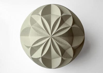 Carved geometric pattern in a sphere